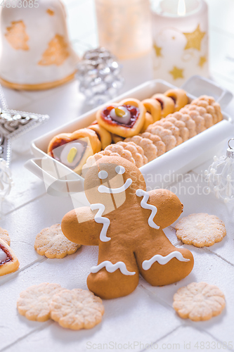 Image of Homemade Christmas cookies and gingerbread with ornaments in white