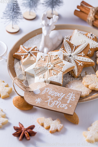 Image of Homemade Christmas cookies with ornaments in white