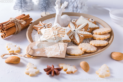 Image of Homemade Christmas cookies with ornaments in white