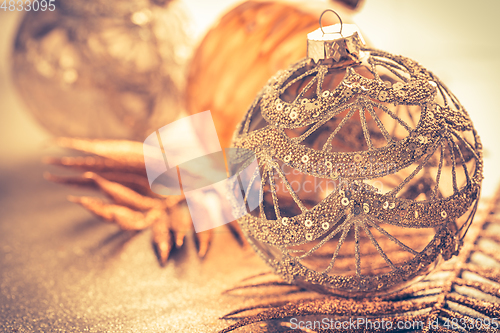 Image of Christmas ornaments in golden tones