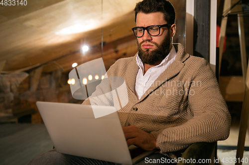 Image of Close up manager working in modern office using devices and gadgets during creative meeting