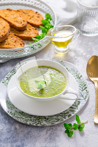 Image of Homemade zucchini soup with tomato ciabatta bread and herbs