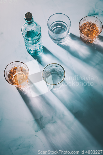 Image of Water in vintage glasses and bottle 