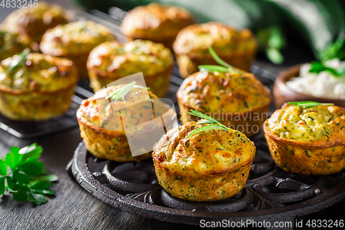 Image of Homemade zucchini muffins with feta cheese and herbs