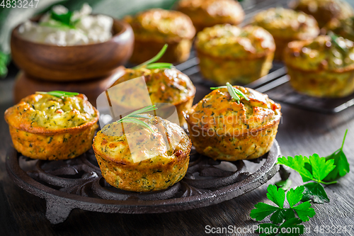 Image of Homemade zucchini muffins with feta cheese and herbs