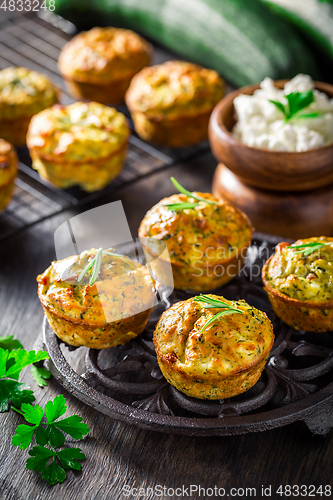 Image of Homemade zucchini muffins with feta cheese and herbs