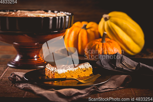 Image of Homemade pumpkin pie with icing for Thanksgiving