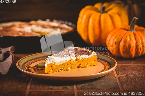 Image of Homemade pumpkin pie with icing for Thanksgiving