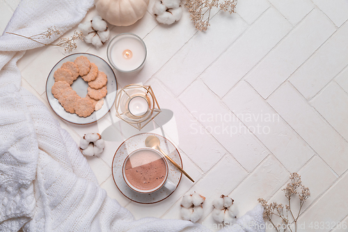 Image of Autumn and winter still life with hot chocolate and cocoa, cookies, candles