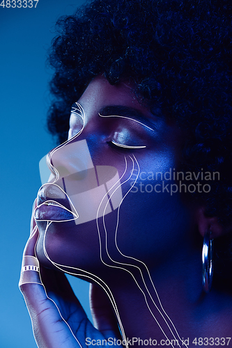 Image of Young woman with fashionable look, stylish make-up and hairstyle, lines design