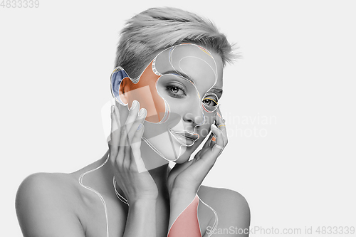 Image of Young woman with fashionable look, stylish make-up and hairstyle, lines design