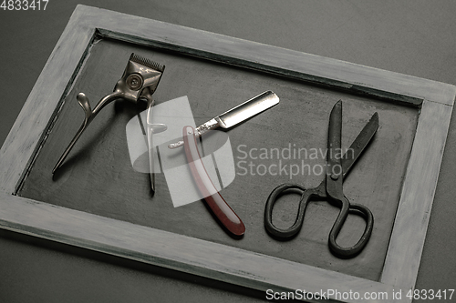 Image of Vintage steel scissors on wooden table background