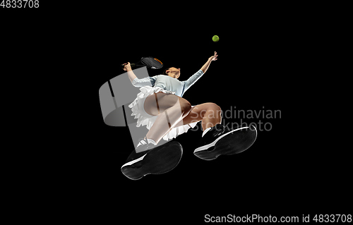 Image of Female professional tennis player in action, motion isolated on black background, look from the bottom. Concept of sport, movement, energy and dynamic.