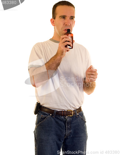 Image of Man Smelling Cough Medicine