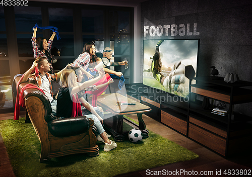Image of Group of friends watching TV, match, sport games