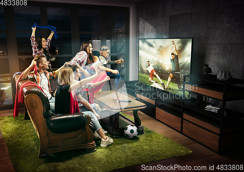 Image of Group of friends watching TV, match, sport games