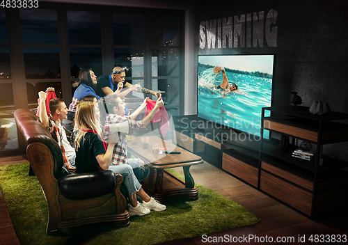 Image of Group of friends watching TV, swimming, sport games