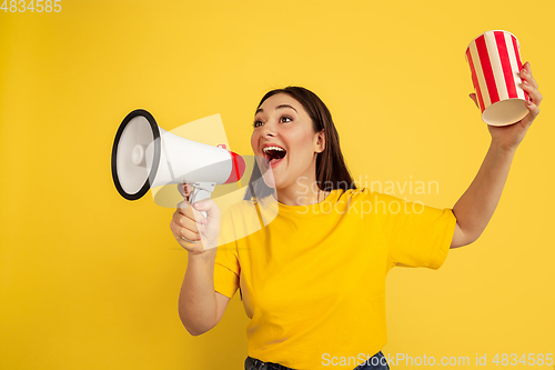 Image of Caucasian woman\'s portrait isolated on yellow studio background