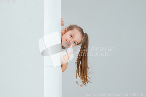 Image of Pretty caucasian girl portrait isolated on white studio background with copyspace