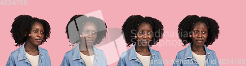 Image of African-american woman portrait isolated on pink studio background with copyspace