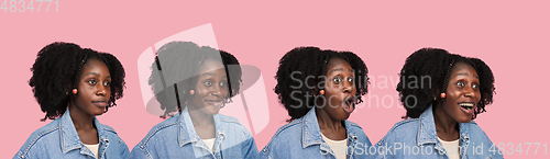 Image of African-american woman portrait isolated on pink studio background with copyspace