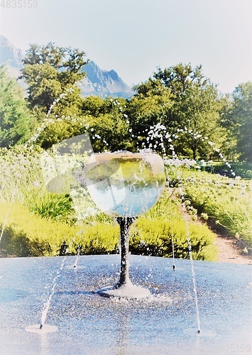 Image of water fountain with a wine glass