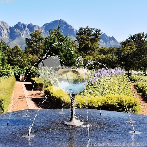 Image of water fountain with a wine glass