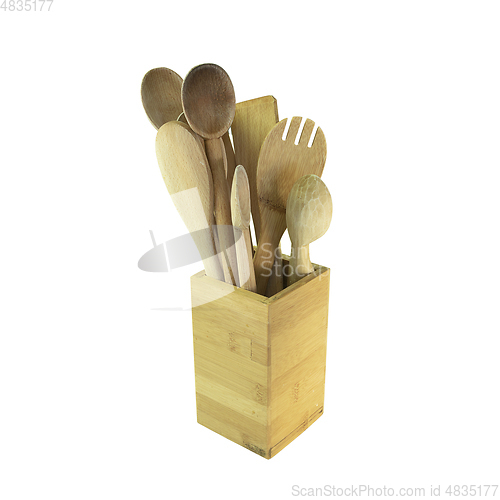 Image of collection of wooden spoons over white