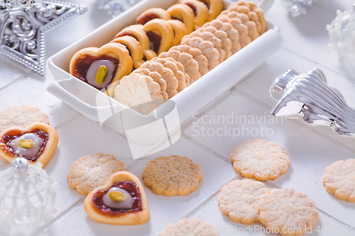 Image of Homemade Christmas cookies with ornaments in white