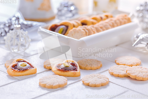 Image of Homemade Christmas cookies with ornaments in white