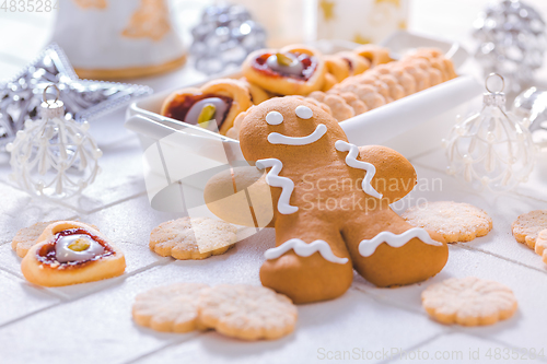 Image of Homemade Christmas cookies and gingerbread with ornaments in white