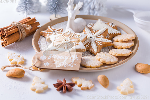 Image of Homemade Christmas cookies with ornaments in white