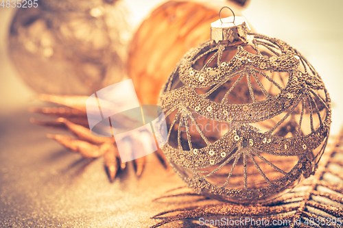 Image of Christmas ornaments in golden tones