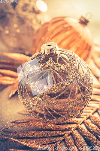 Image of Christmas ornaments in golden tones