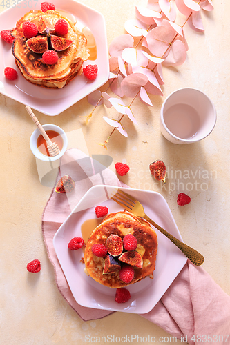 Image of Sweet curd cheese pancakes with fresh raspberry, figs and maple sirup