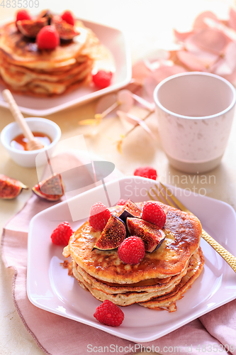 Image of Sweet curd cheese pancakes with fresh raspberry, figs and maple sirup