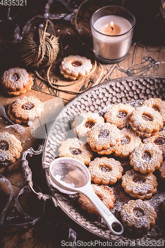 Image of Homemade Christmas cookies with candles in white vintage style