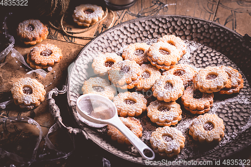 Image of Homemade Christmas cookies with candles in white vintage style