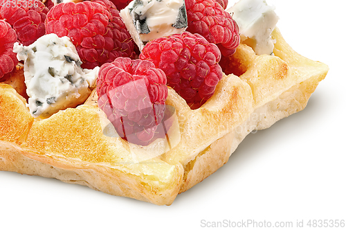 Image of Closeup of french waffles with raspberries and dorblu cheese