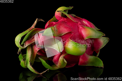 Image of Dragon fruit horizontally rotated on a black background