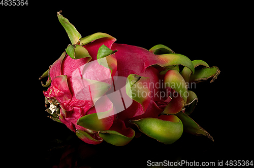 Image of Dragon fruit horizontally on a black background