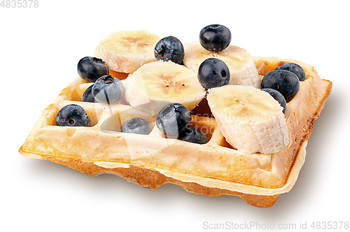 Image of French waffles with blueberries and bananas isolated on white