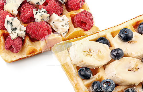 Image of French waffles with berries, bananas and dorblu cheese isolated