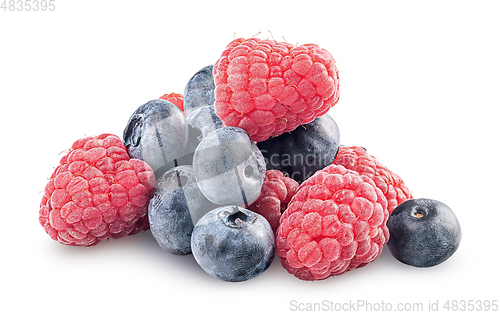 Image of Heap of raspberries and blueberries isolated on white