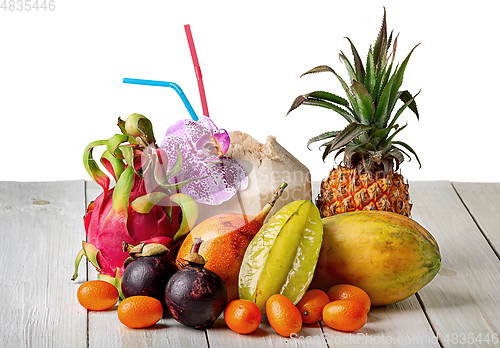 Image of Tropical fruits on wooden table top view