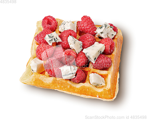 Image of French waffles with raspberries and dorblu cheese top wiev