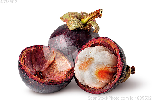 Image of Whole and opened mangosteen with shells isolated on white