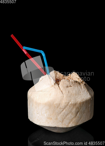 Image of Young coconut isolated on a black background