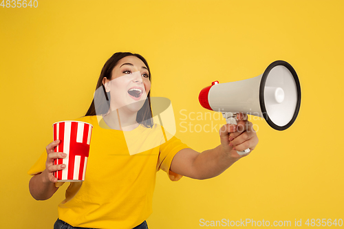 Image of Caucasian woman\'s portrait isolated on yellow studio background