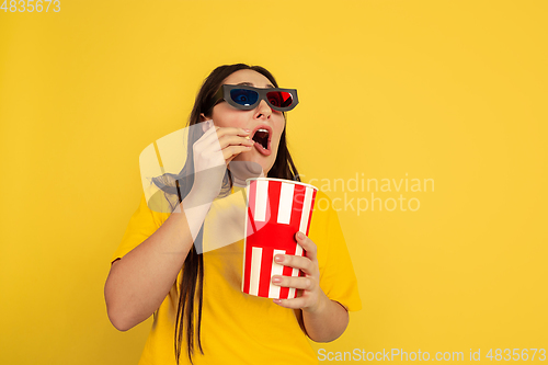 Image of Caucasian woman\'s portrait isolated on yellow studio background